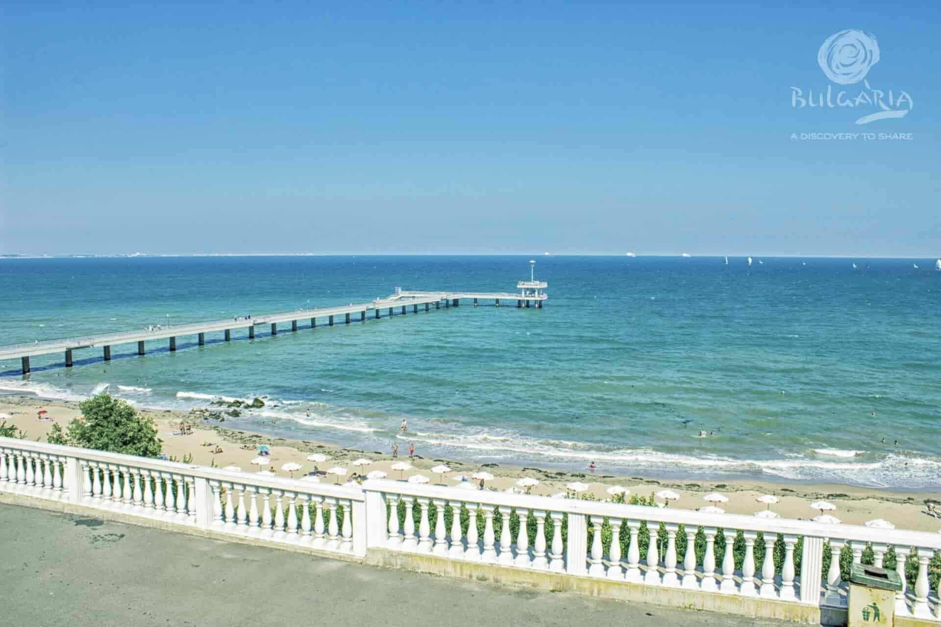 a long pier on a beach