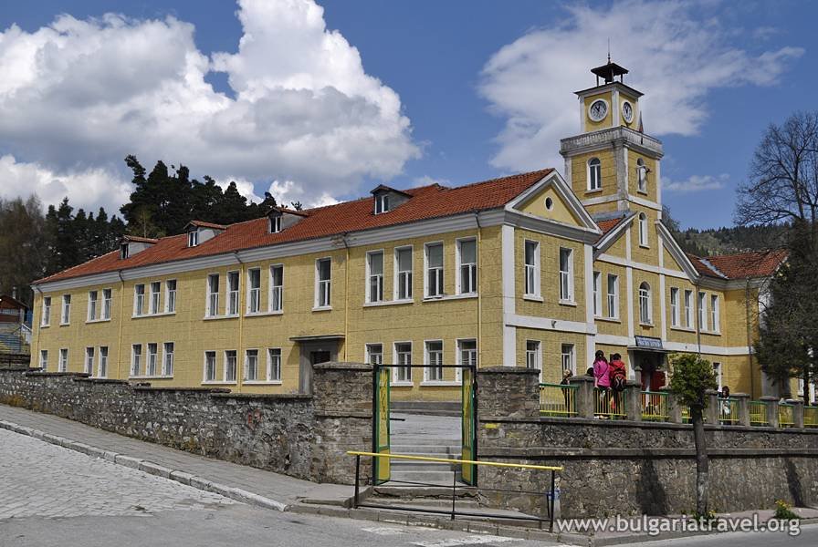 a yellow building with a clock tower